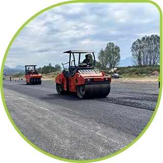 Road construction roller machine operating on asphalt